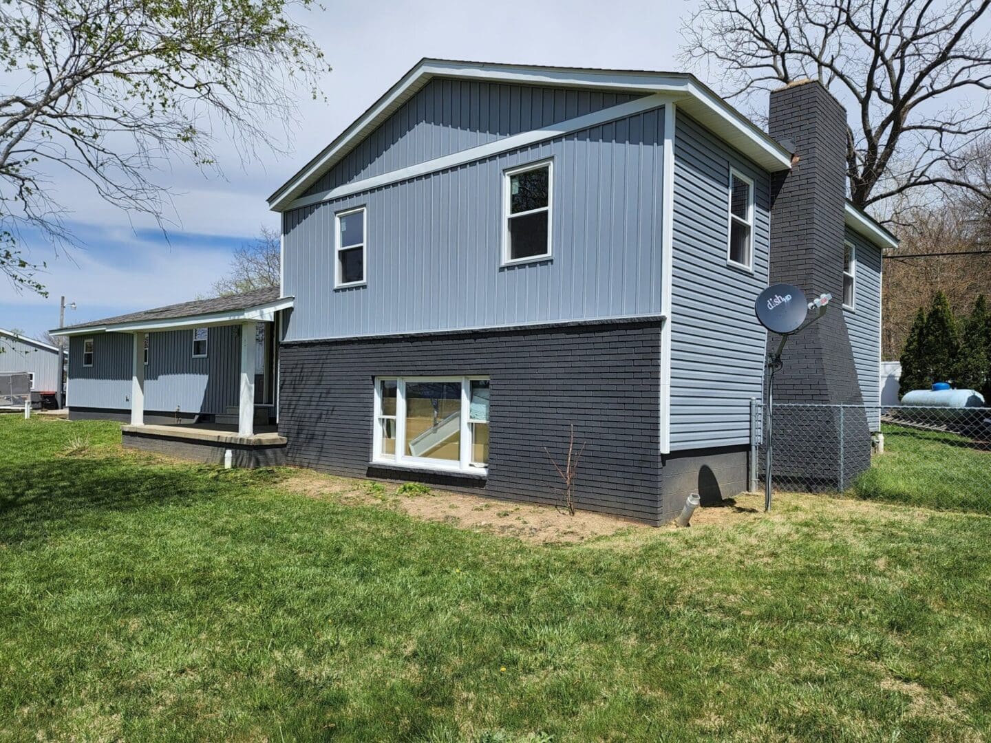 A house with blue siding and black trim.